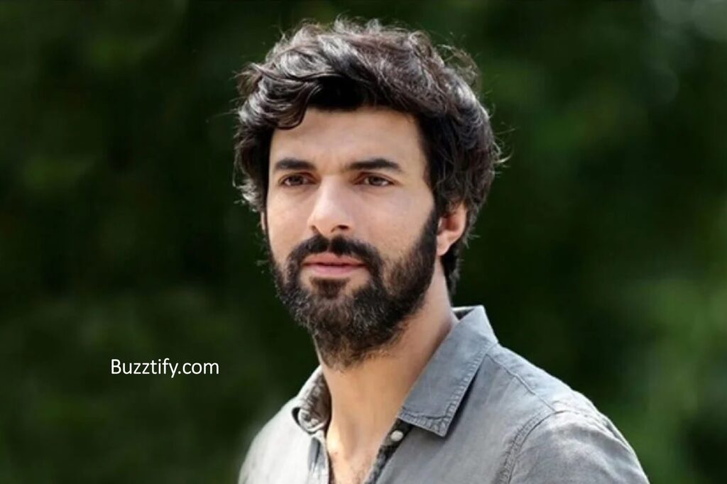 Engin Akyurek in shirt and stubble look