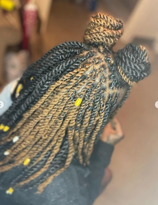 gold and black marley twist with bun hair